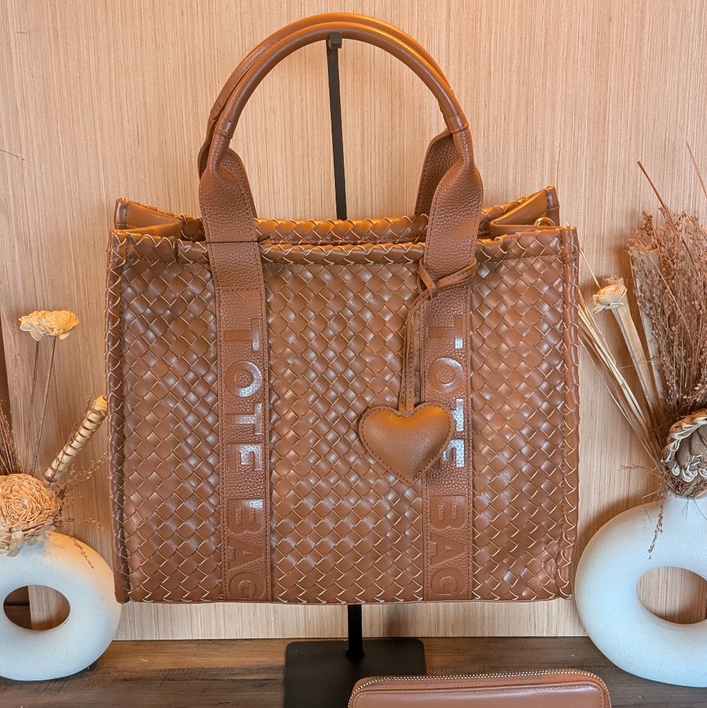 Brown Woven Tote Bag With Wallet And Heart Charm And Crossbody Strap.
